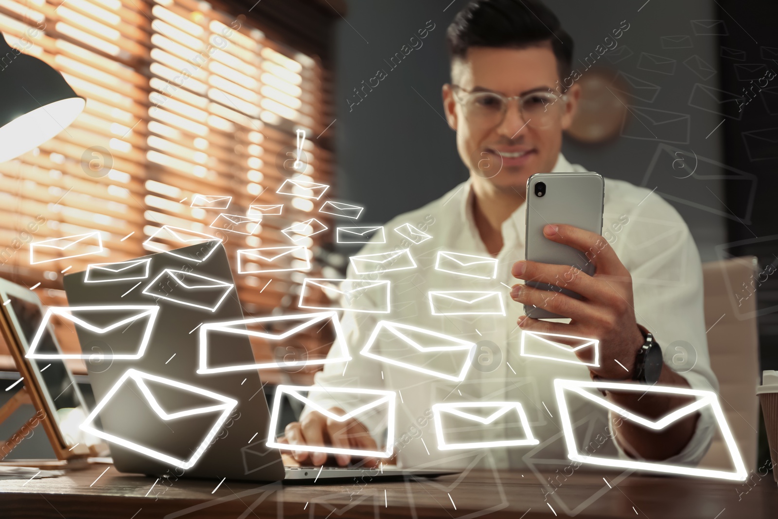 Image of Businessman sending emails at table indoors, focus on hand