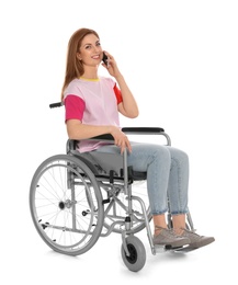Photo of Beautiful woman in wheelchair talking on mobile phone, white background