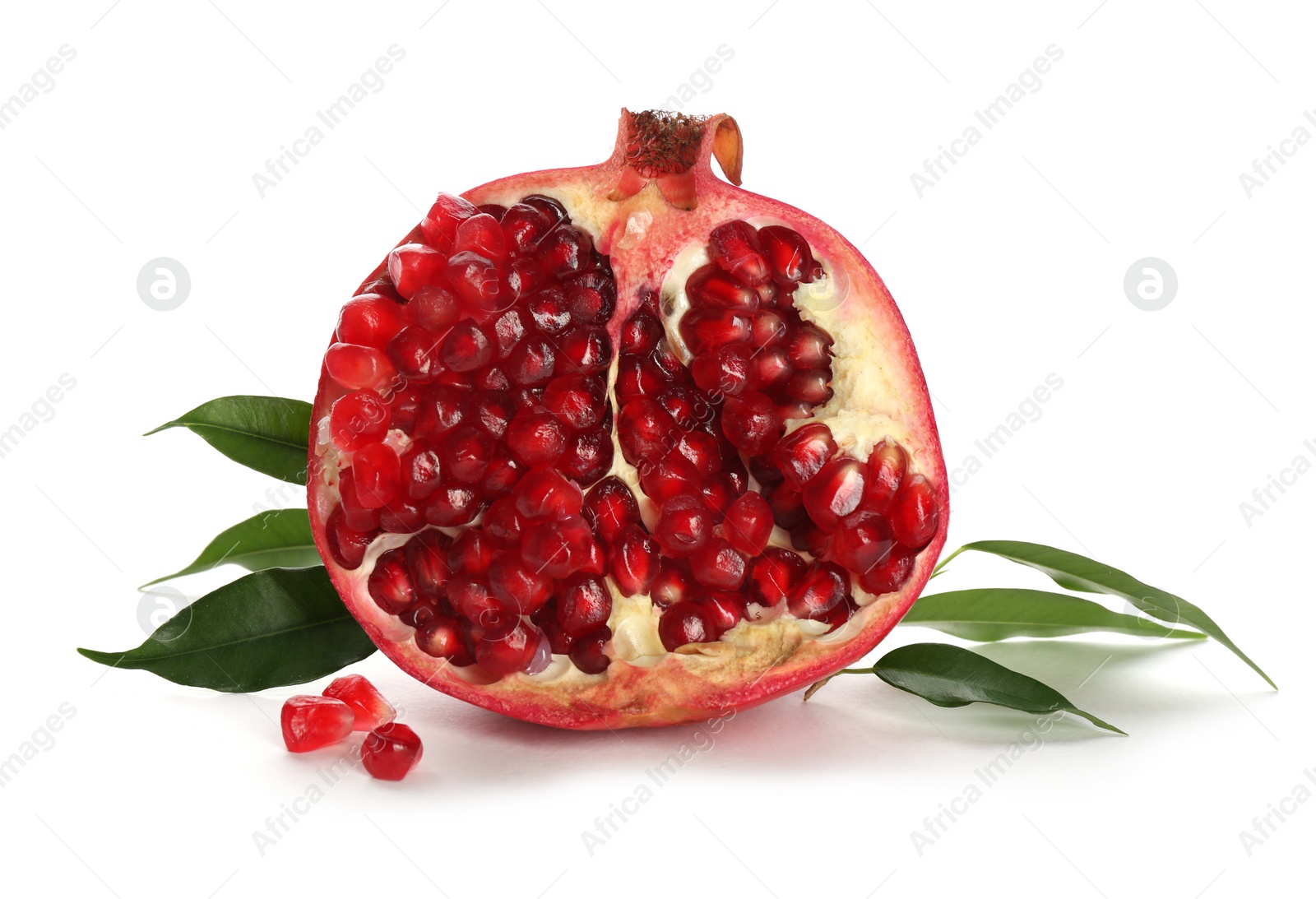 Photo of Ripe pomegranate with leaves on white background