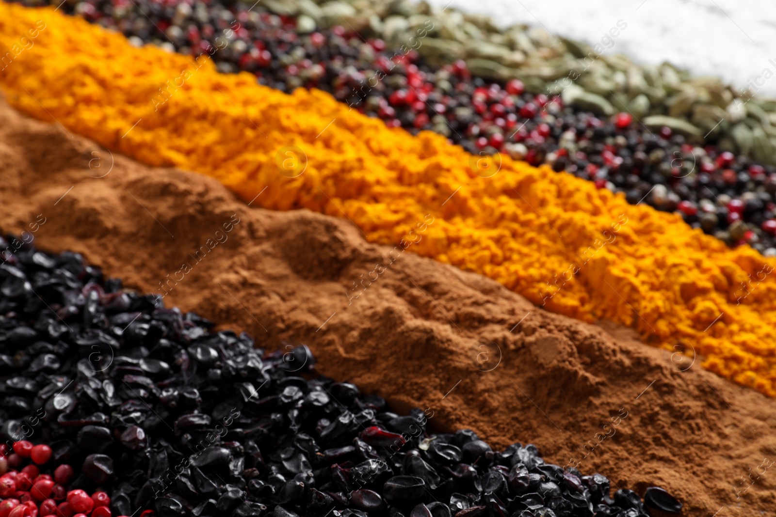 Photo of Many different spices as background, closeup view