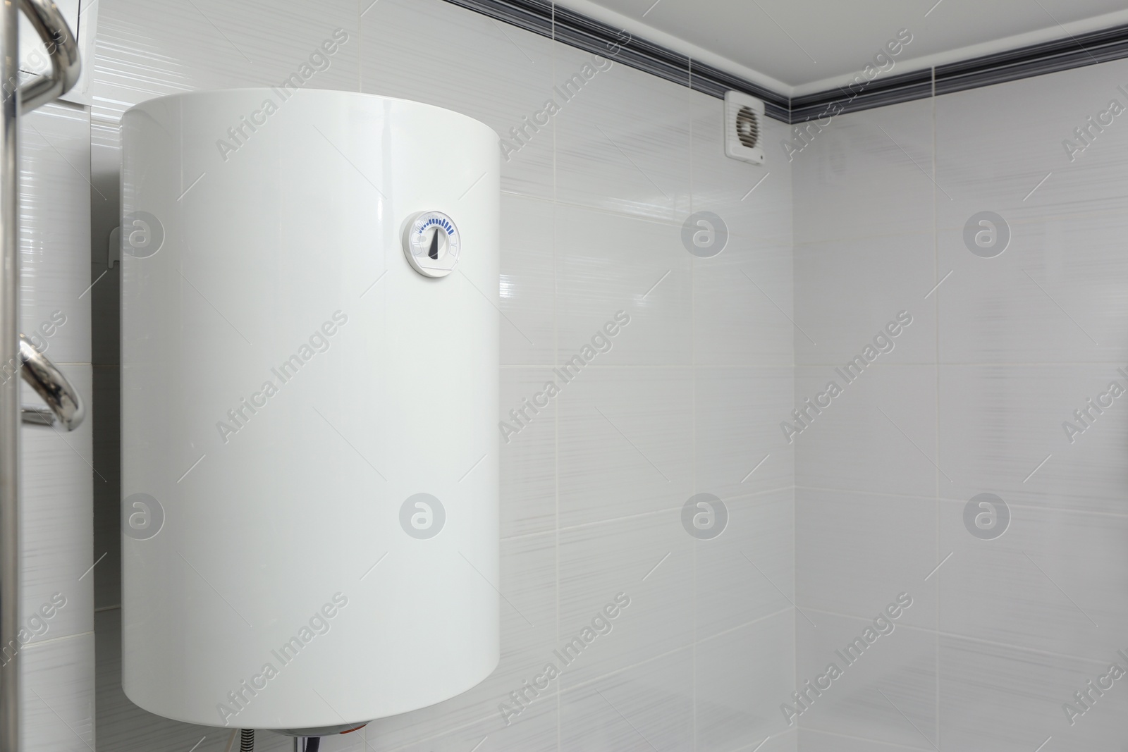 Photo of White boiler with temperature control indicator indoors, space for text