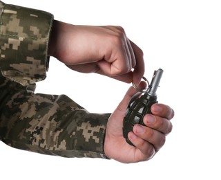 Photo of Soldier pulling safety pin out of hand grenade on white background, closeup