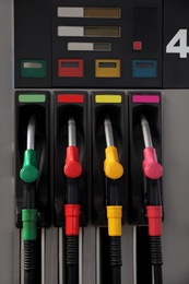 Petrol pump filling nozzles at gas station
