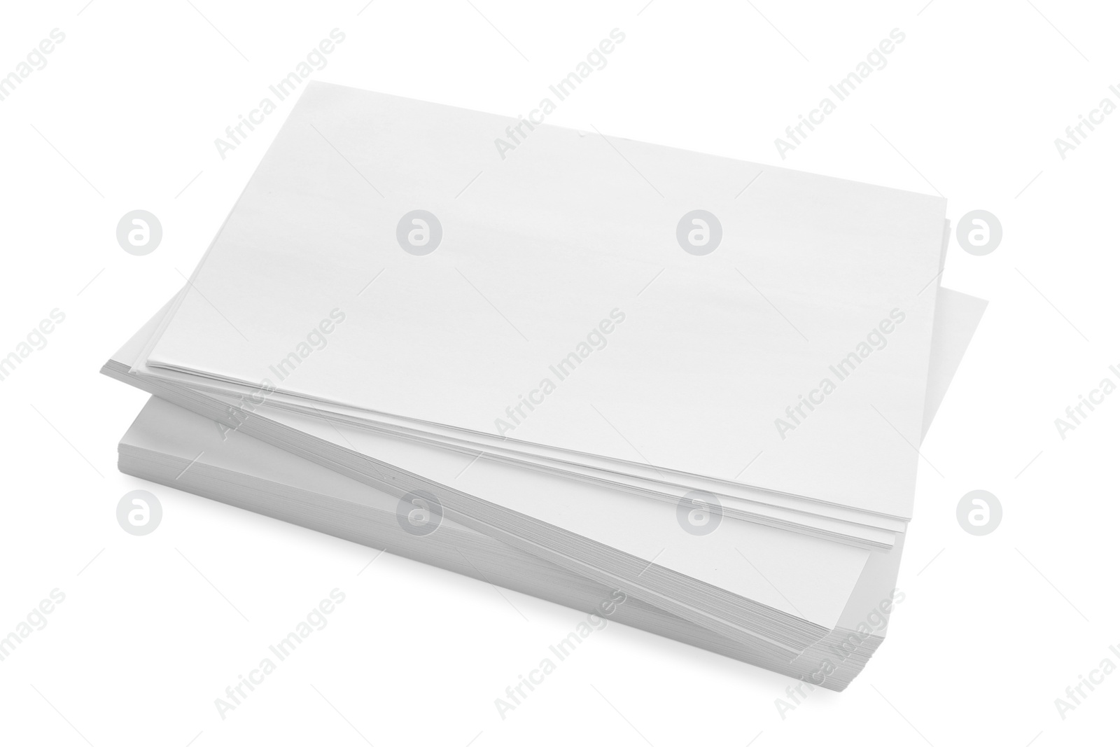 Photo of Stack of blank paper sheets isolated on white, above view. Space for text