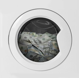 Image of Money laundering. Many dollar banknotes in washing machine