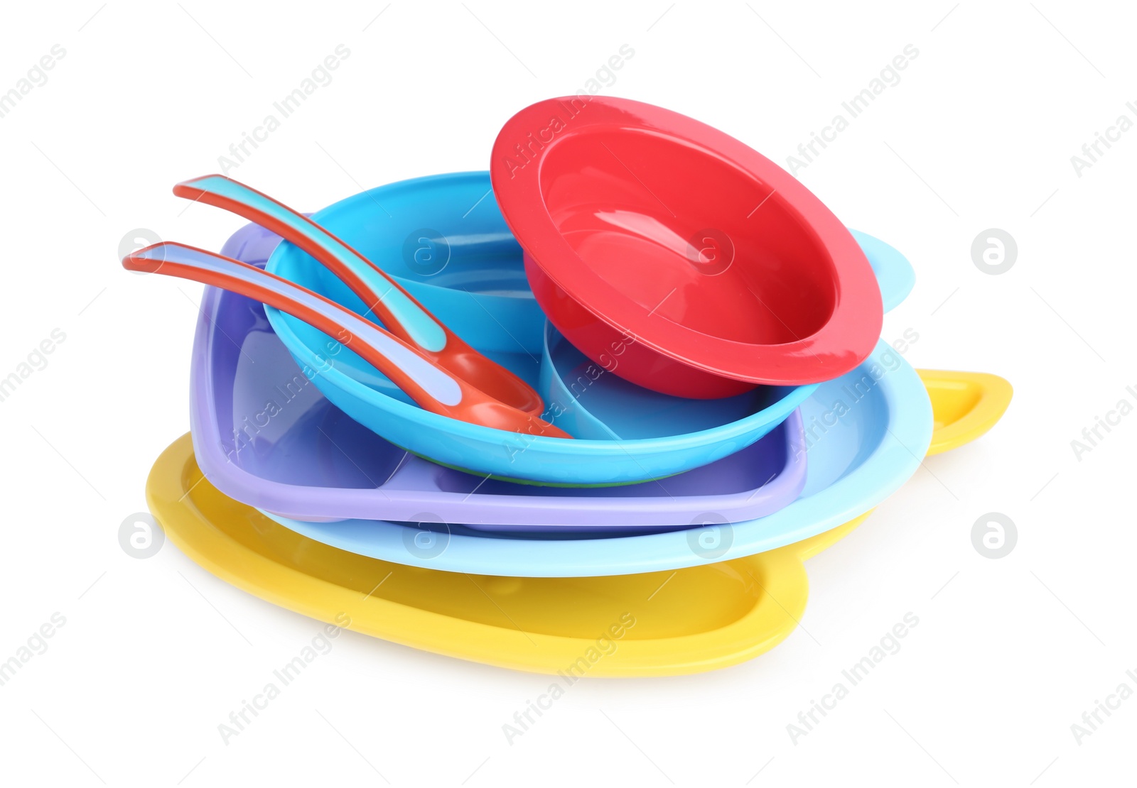Photo of Pile of colorful plastic dishware isolated on white. Serving baby food
