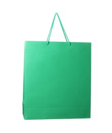 Photo of One green shopping bag isolated on white