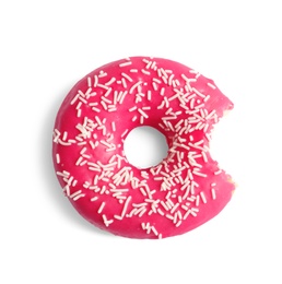 Delicious bitten doughnut with sprinkles on light background