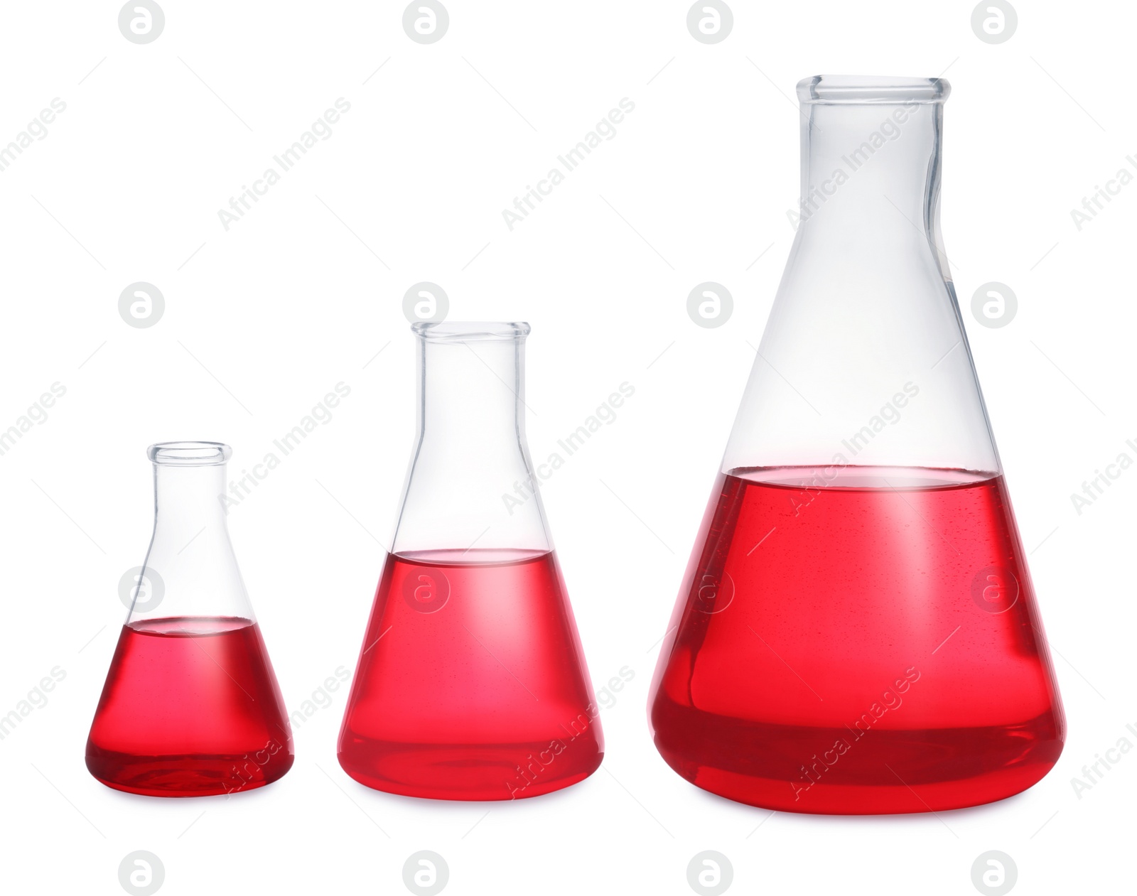 Photo of Conical flasks with red liquid on white background. Laboratory glassware