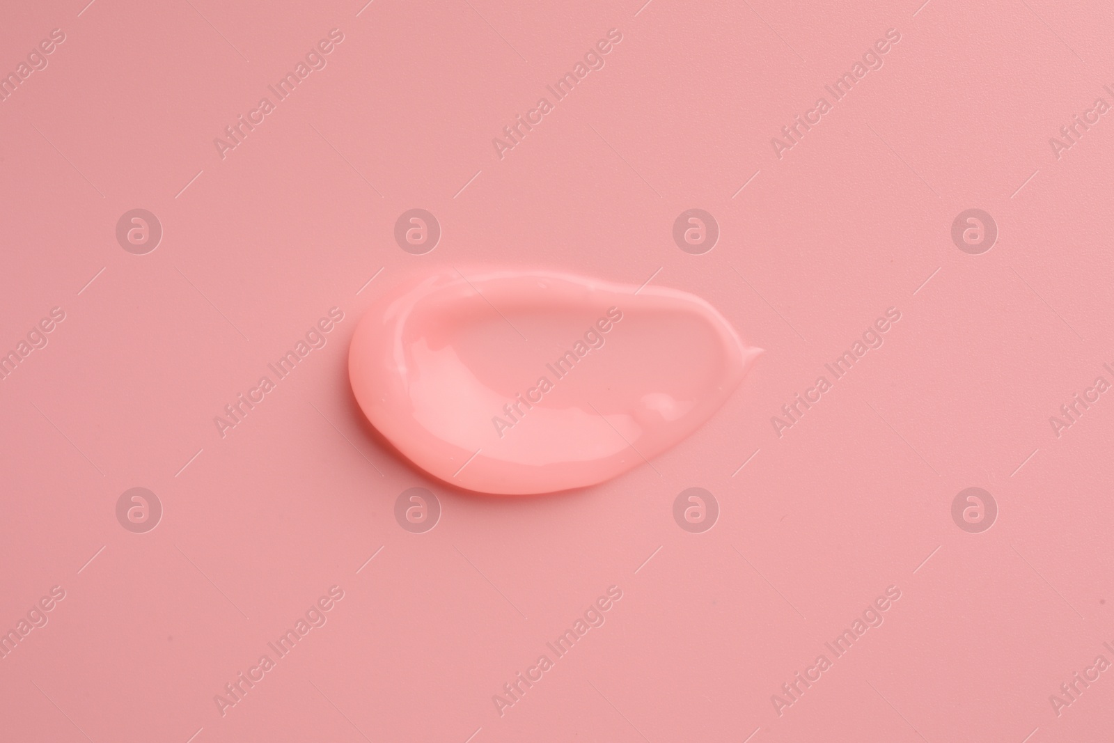 Photo of Sample of cosmetic gel on pink background, top view