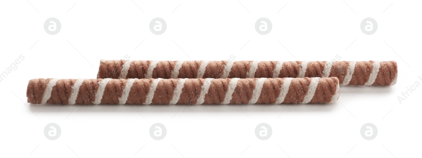 Photo of Tasty wafer roll sticks on white background. Crispy food