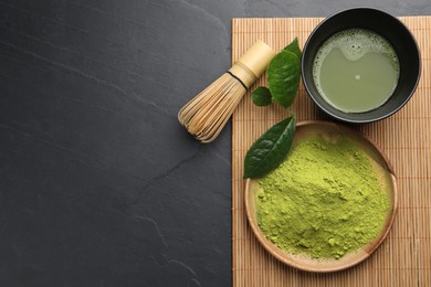 Photo of Flat lay composition with green matcha powder and fresh beverage on black table. Space for text