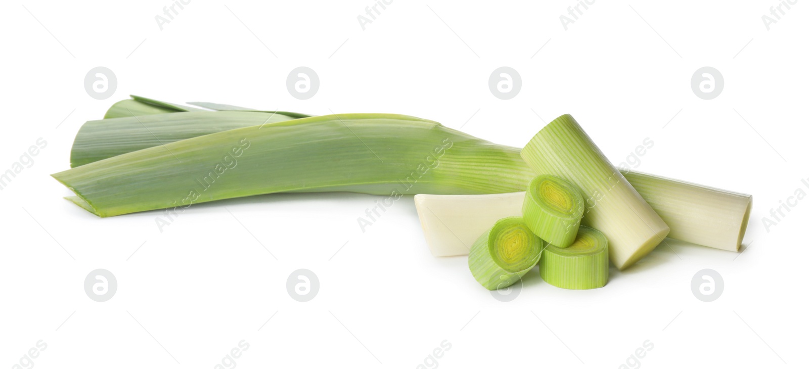 Photo of Whole and cut fresh leeks on white background