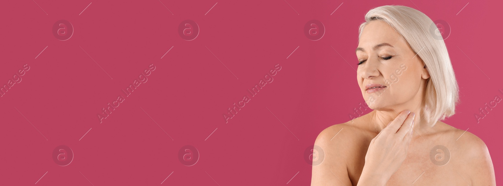 Image of Portrait of beautiful mature woman on pink background, space for text. Banner design