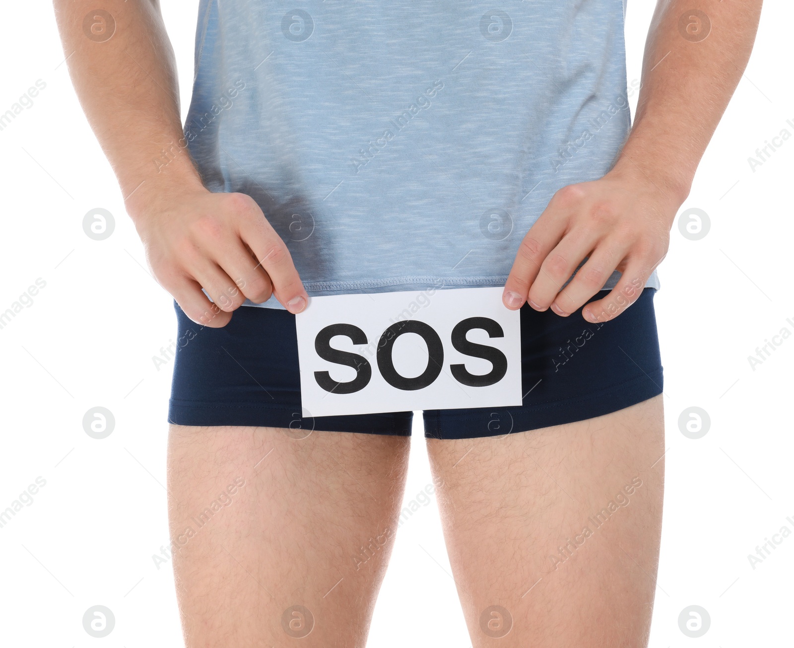 Photo of Man holding SOS sign on white background, closeup. Urology problems
