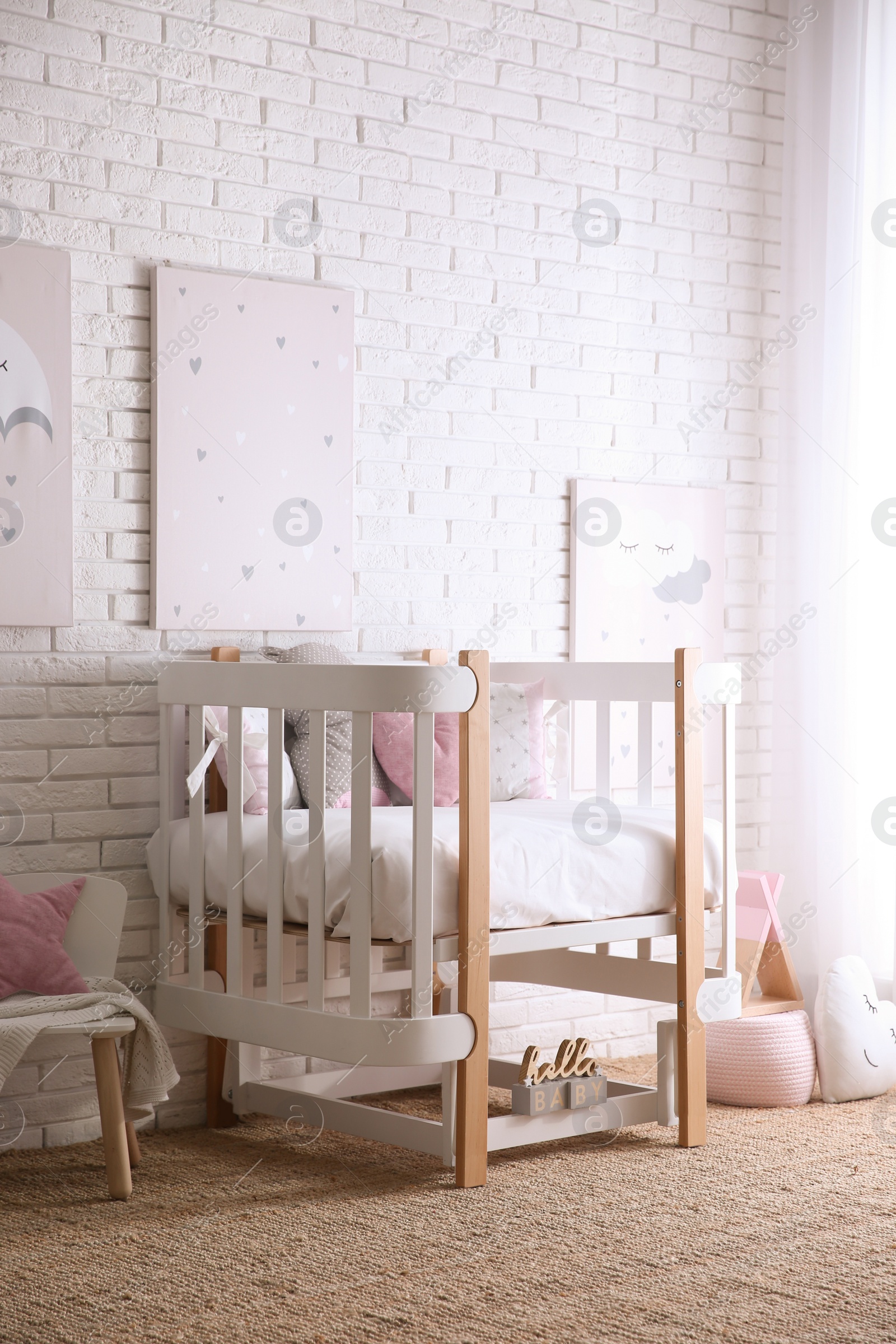 Photo of Baby room interior with toys and stylish furniture