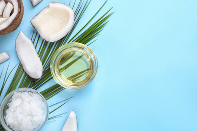 Photo of Flat lay composition with coconut oil on light blue background, space for text