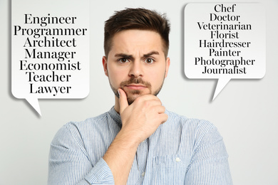 Thoughtful young man choosing profession on light background