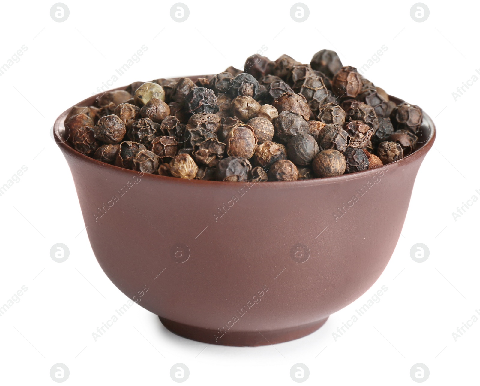 Photo of Bowl of black peppercorns isolated on white