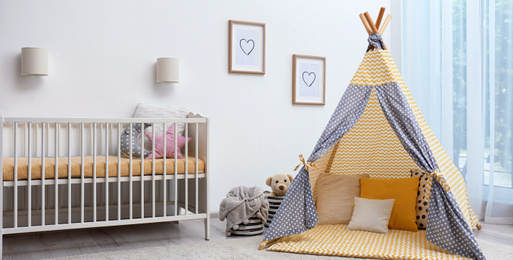 Image of Baby room interior with comfortable crib and play tent. Banner design