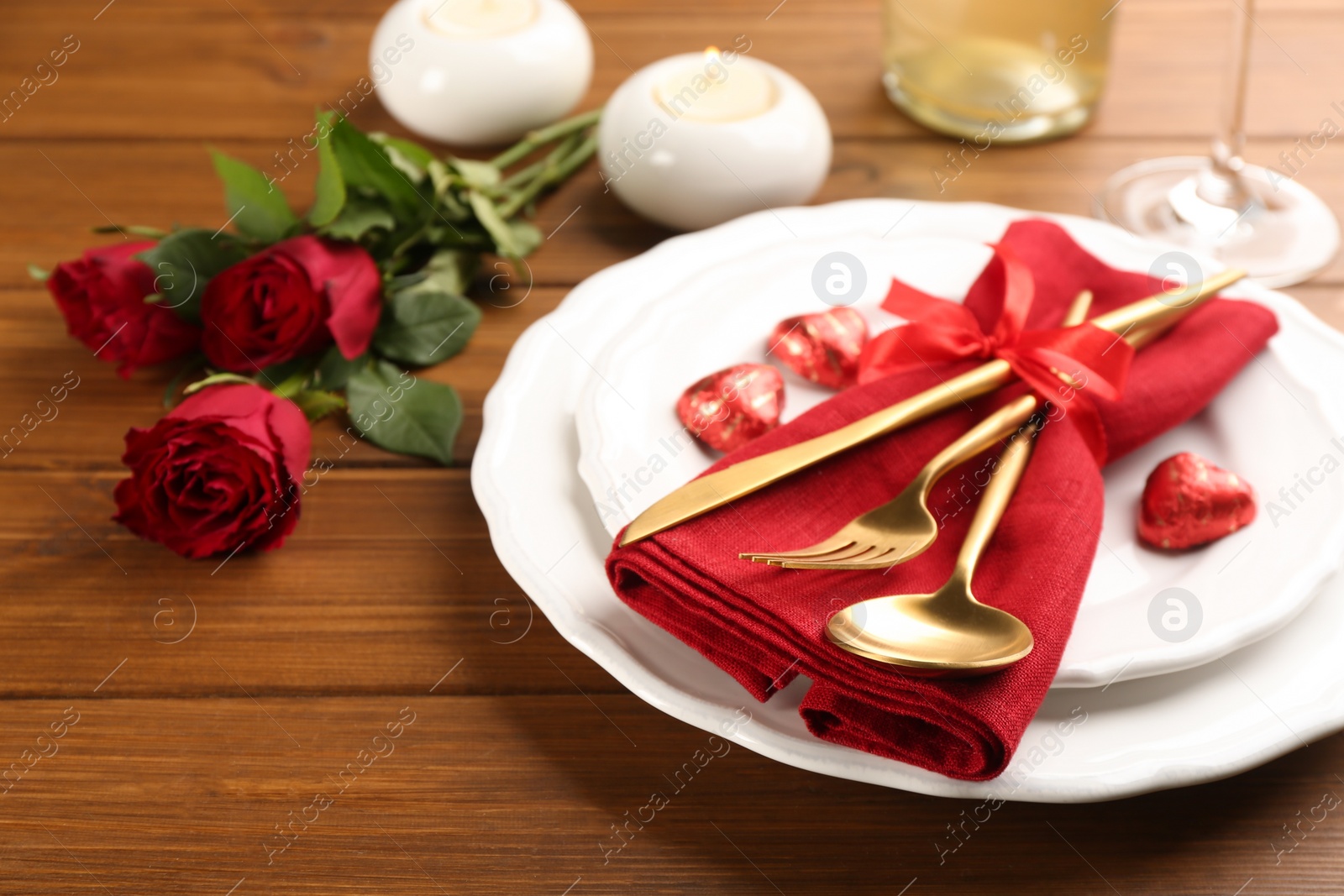 Photo of Beautiful table setting for Valentine's Day dinner on wooden background, closeup