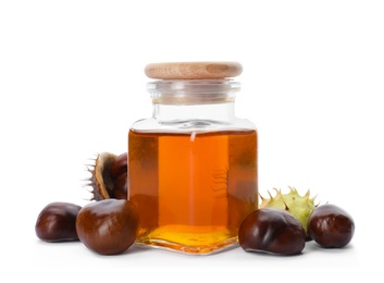 Horse chestnuts and bottle of tincture on white background