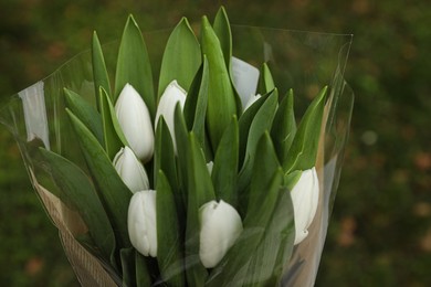 Beautiful bouquet of white tulips outdoors, closeup