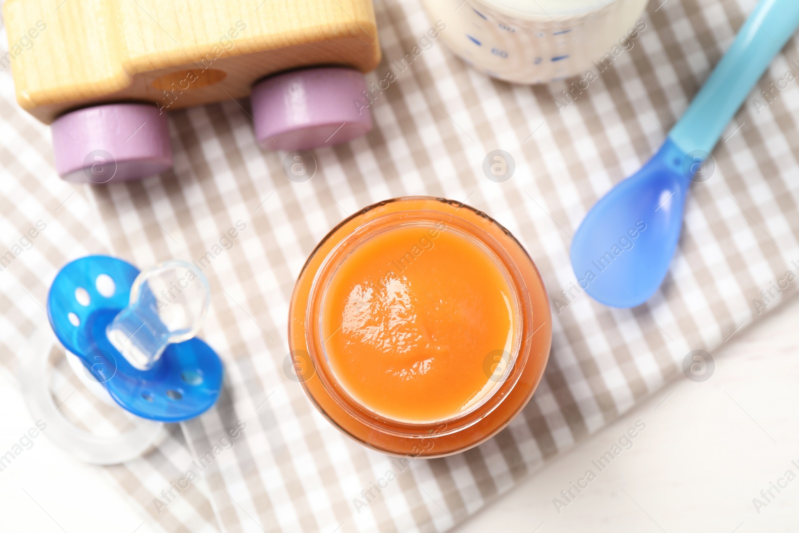 Photo of Flat lay composition with healthy baby food on white table