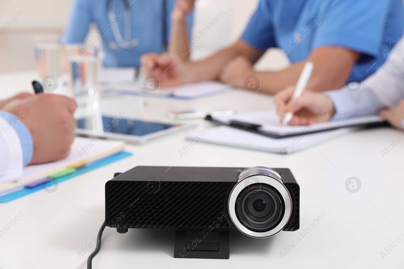 Photo of Video projector on table during medical conference