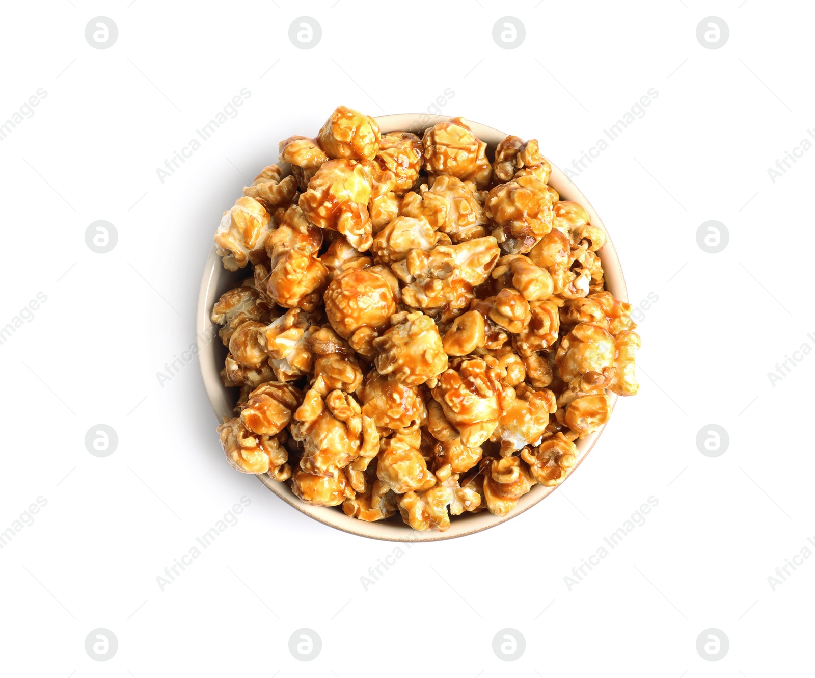 Photo of Delicious popcorn with caramel in bowl on white background