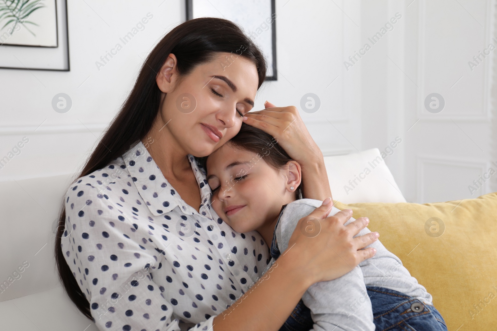 Photo of Happy mother and daughter hugging at home. Single parenting