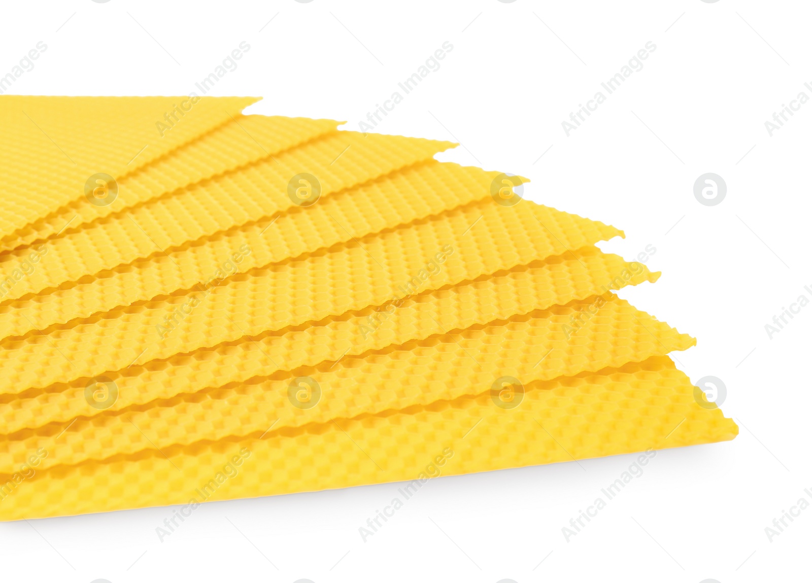 Photo of Natural organic beeswax sheets on white background