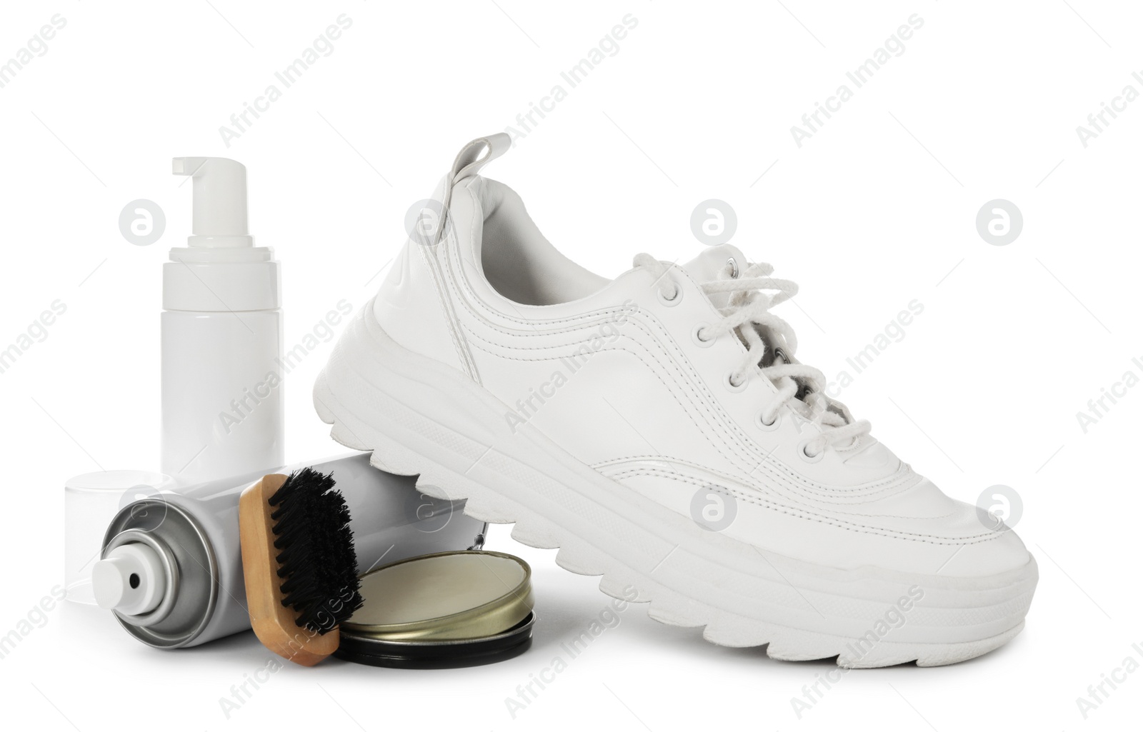 Photo of Composition with stylish footwear and shoe care accessories on white background