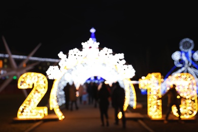 Photo of Beautiful bright Christmas decor outdoors. Bokeh effect