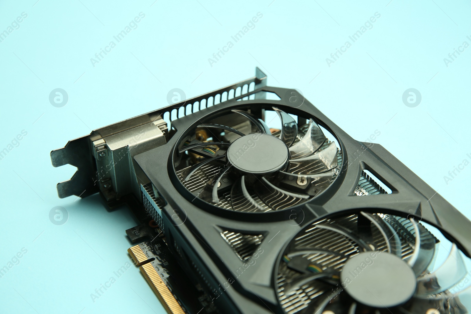 Photo of One graphics card on light blue background, closeup