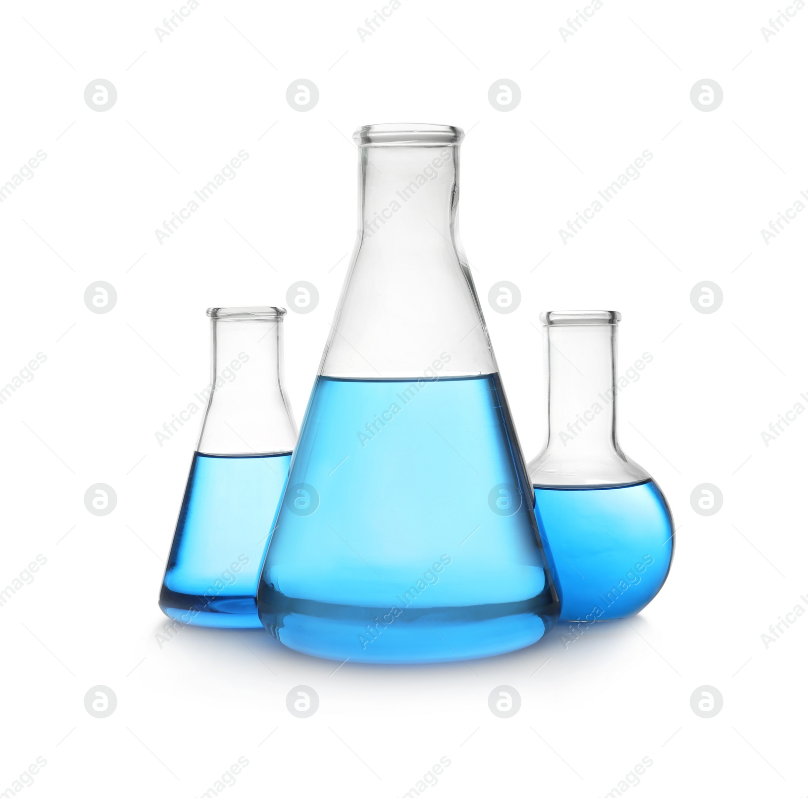 Photo of Florence and conical flasks with blue liquid on white background. Laboratory glassware