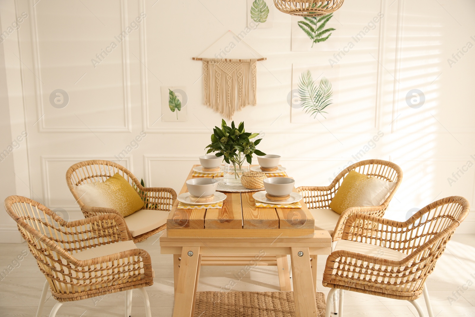 Photo of Stylish wooden dining table and chairs in room. Interior design