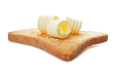 Photo of Toast with tasty butter curls on white background