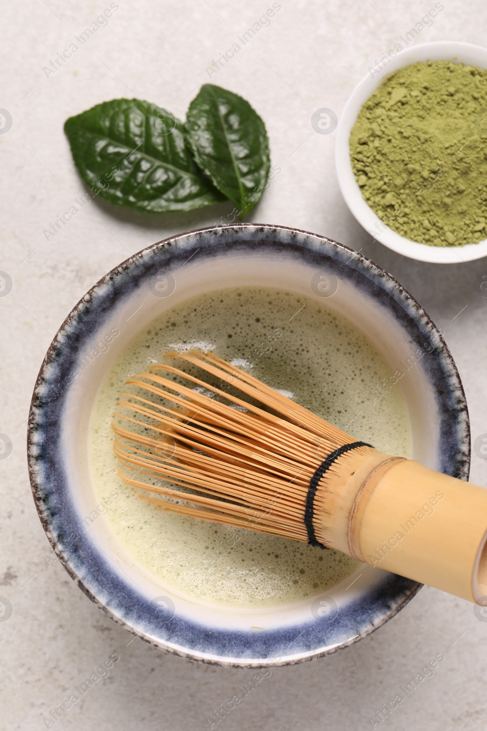 Photo of Flat lay composition with matcha tea on light gray table