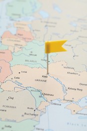 MYKOLAIV, UKRAINE - NOVEMBER 09, 2020: Kyiv city marked with push pin on political map Eastern Europe, closeup