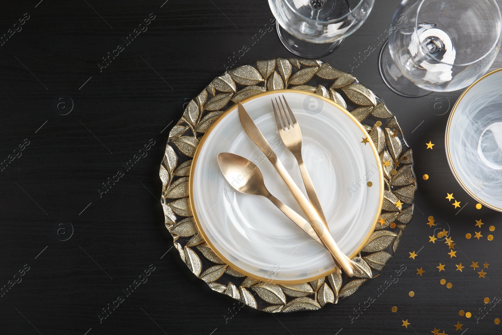 Photo of Elegant table setting on dark background, top view