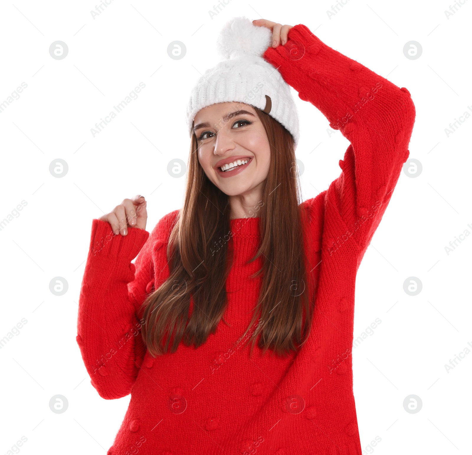 Photo of Happy young woman in hat and red sweater on white background. Winter season