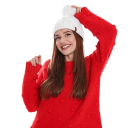 Photo of Happy young woman in hat and red sweater on white background. Winter season