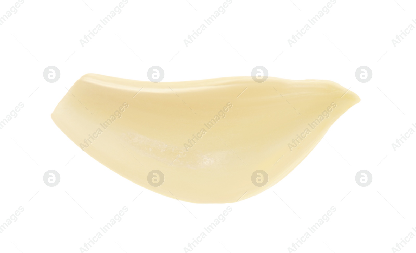 Photo of One peeled clove of garlic isolated on white