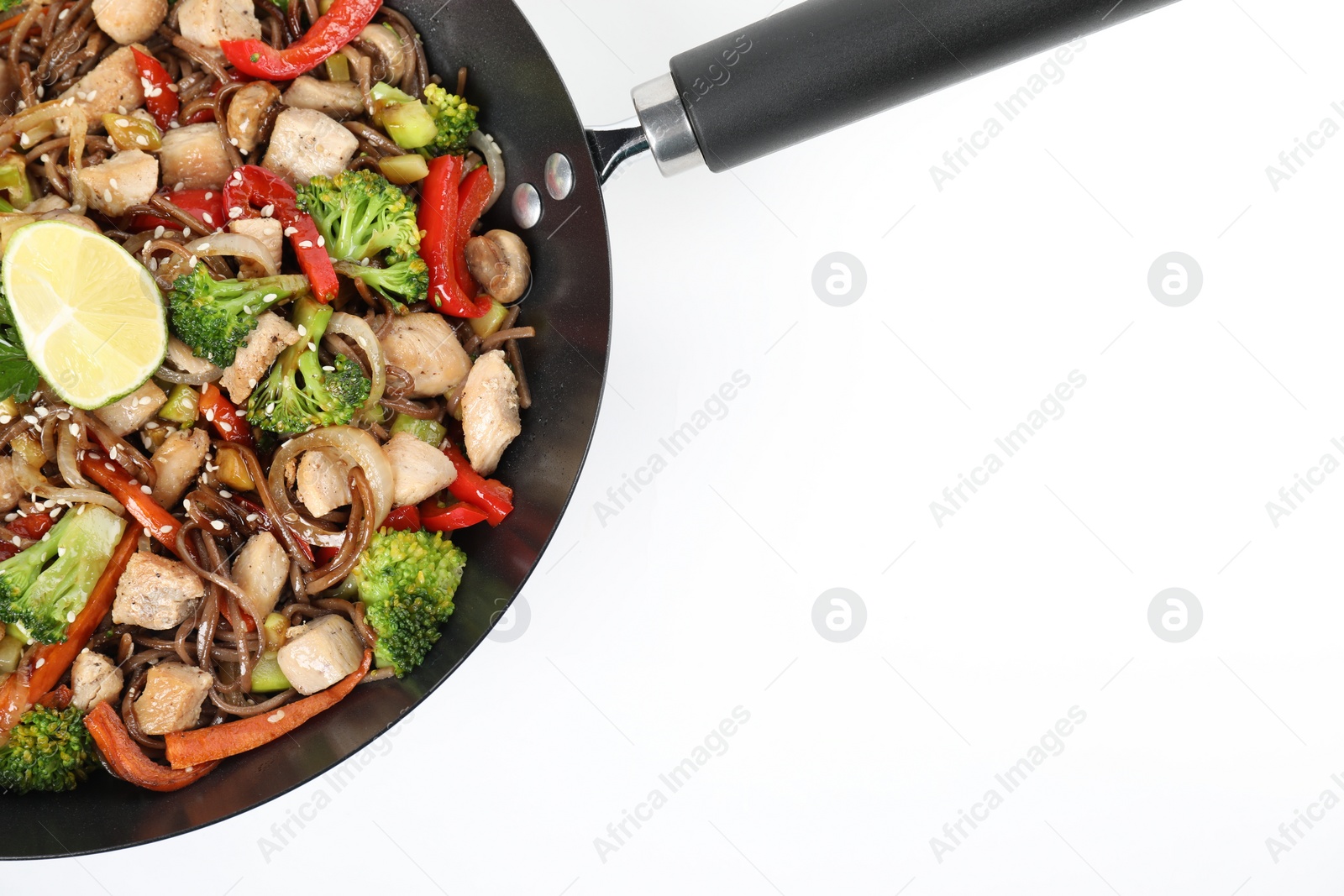 Photo of Stir-fry. Tasty noodles with meat and vegetables in wok on white background, top view. Space for text