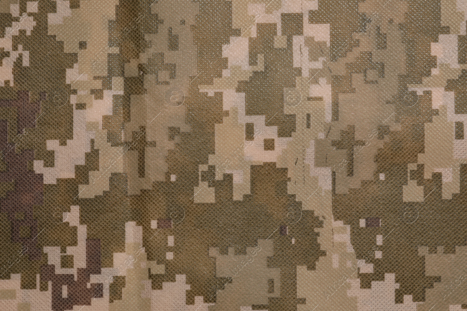 Photo of Texture of camouflage fabric as background, top view