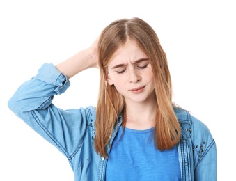 Teenage girl suffering from headache on white background