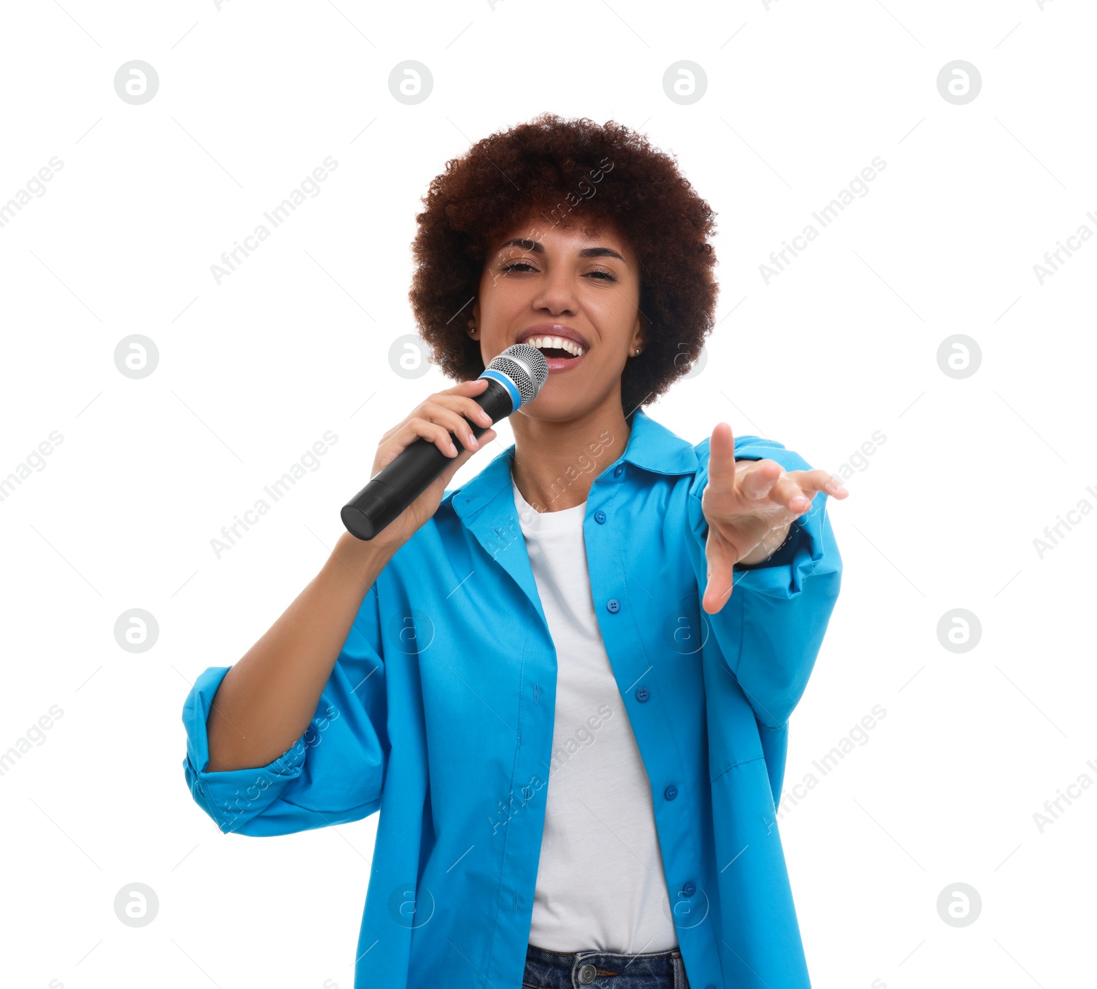 Photo of Curly young woman with microphone singing on white background