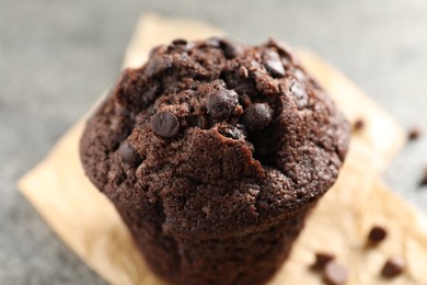 Photo of Delicious fresh chocolate muffin on table, closeup