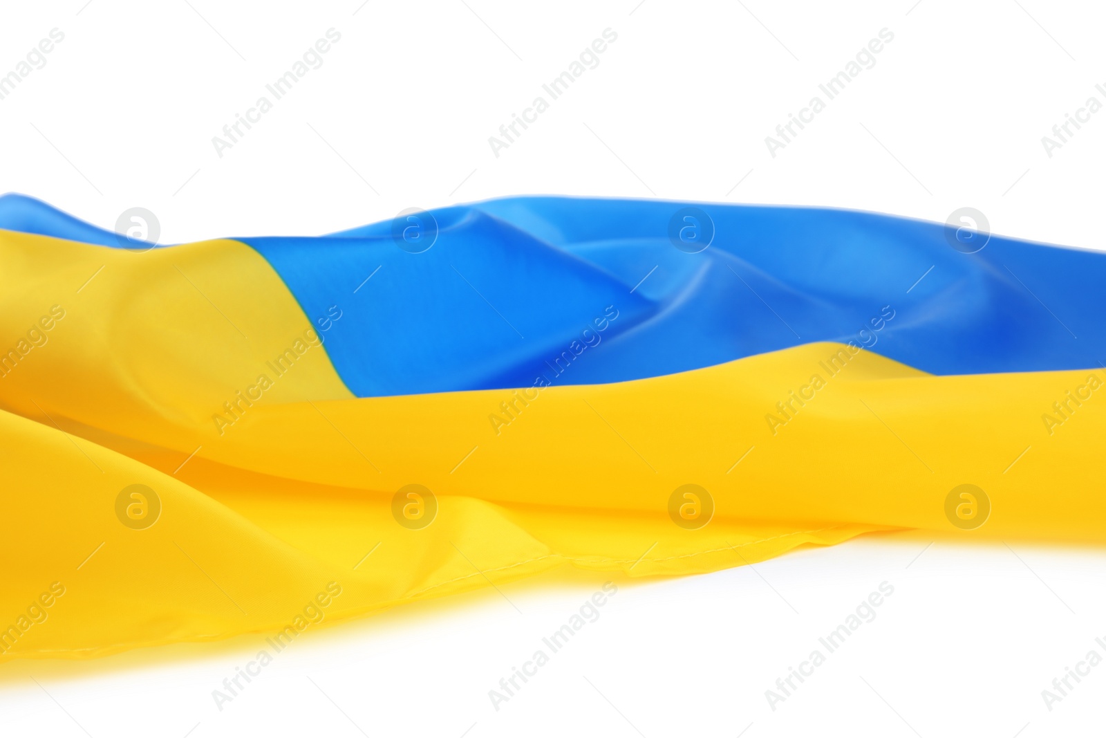 Photo of National flag of Ukraine on white background, closeup